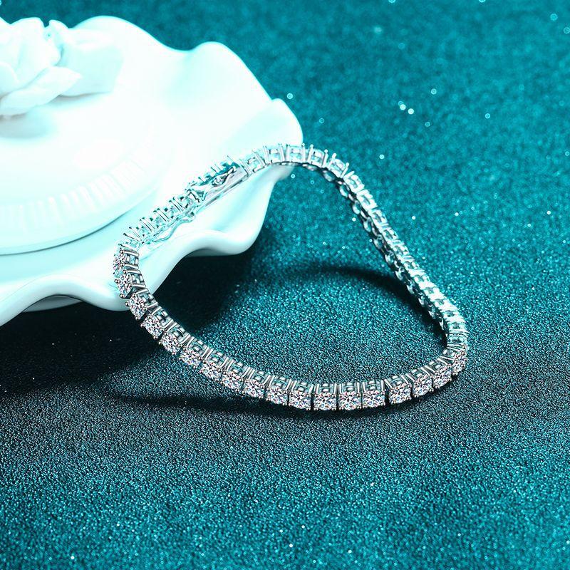 Sterling Silver Bracelet with Platinum-Plated Four-Prong Setting and Moissanite Stones