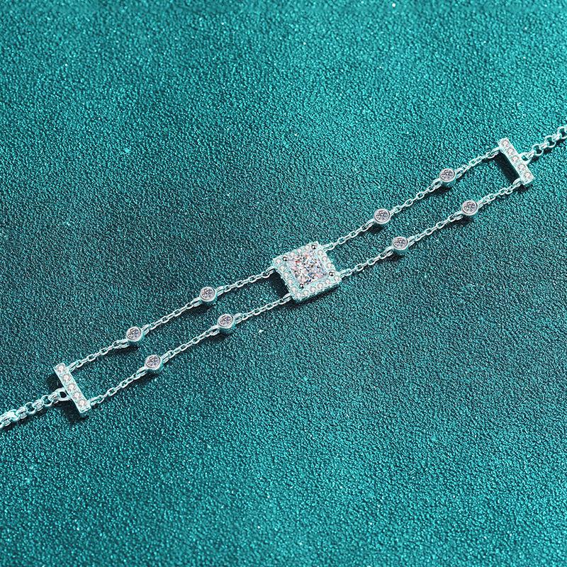 Sterling Silver Dual Chain Bracelet with Square-Cut Moissanite and Blue Gemstones in Leaf and Star Motifs