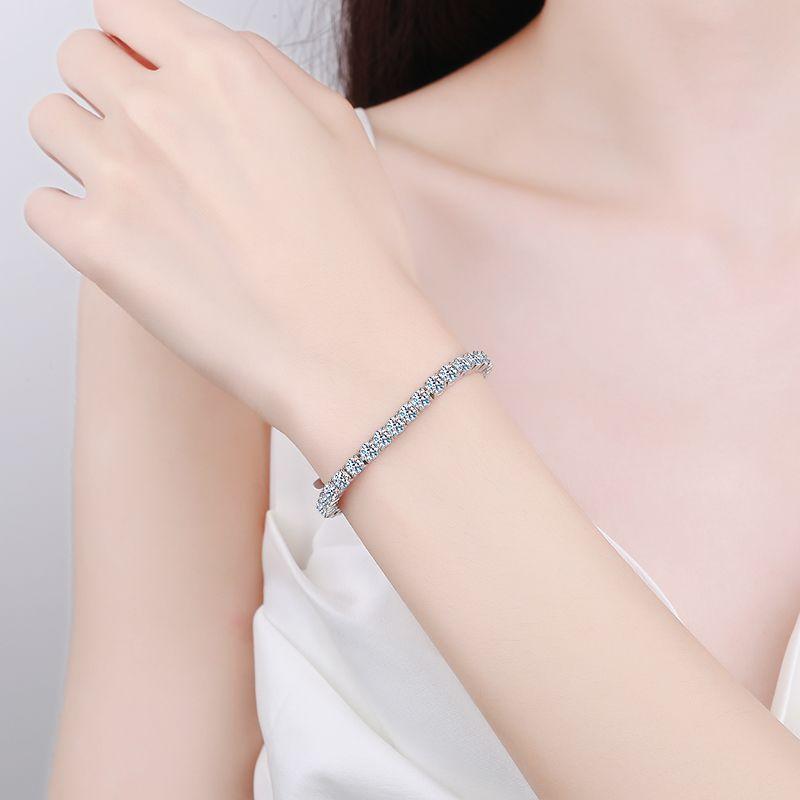 Sterling Silver Bracelet with Platinum-Plated Four-Prong Setting and Moissanite Stones