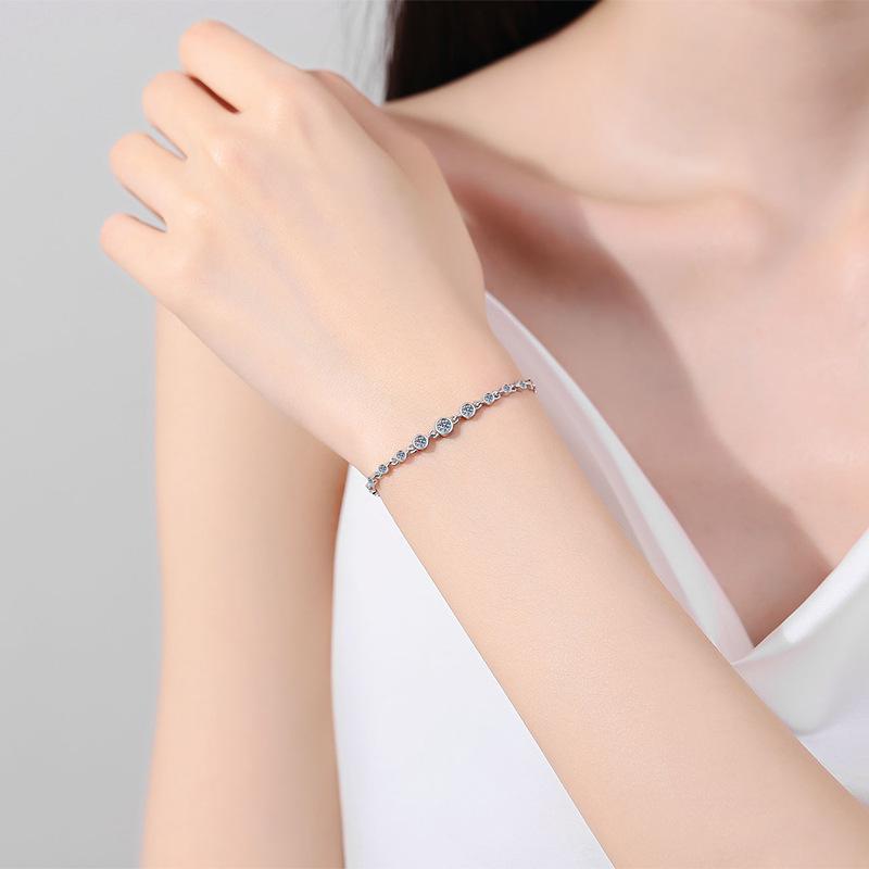 Women's Sterling Silver Moissanite Bracelet with Champagne Gold Finish and Lucky Charm Designs